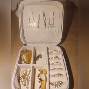 Gold color jewelry with jewelry box.